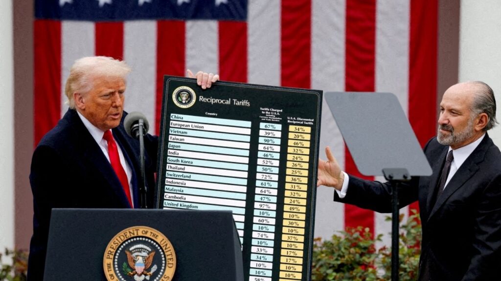 President Donald Trump holds a chart next to U.S. Secretary of Commerce Howard Lutnick as Trump delivers remarks on tariffs in the Rose Garden at the White House in Washington, D.C., U.S., April 2, 2025. (Reuters File)