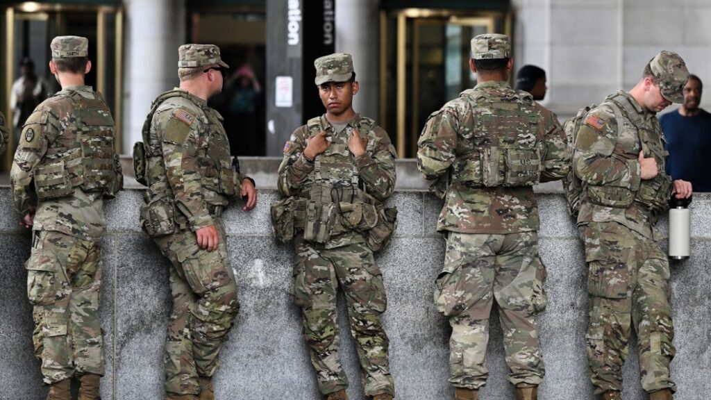 Soldiers with the 30th Armored Combat Brigade from the South Carolina National Guard at Union Station in Washington, Aug. 20, 2025. Defense Secretary Pete Hegseth has authorized National Guard troops deployed to Washington to bring their weapons with them on their mission. (Kenny Holston/The New York Times)