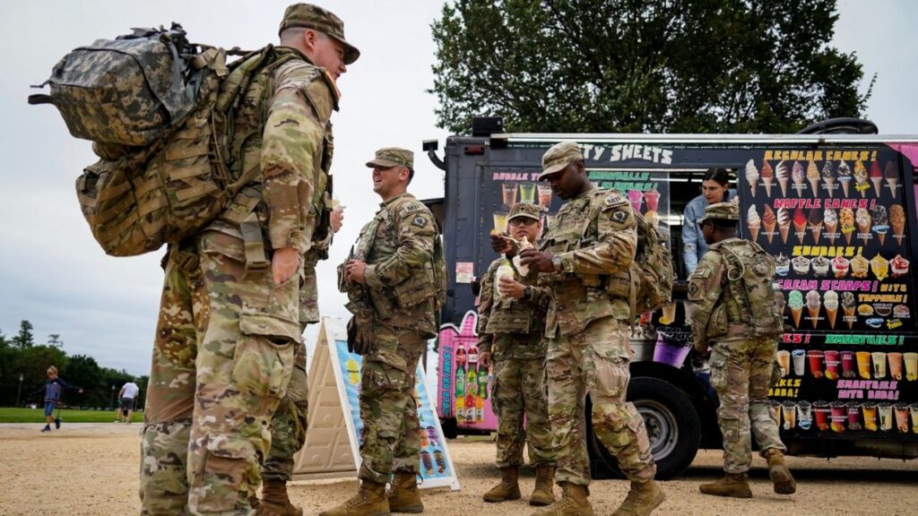 Members of the Mississippi National Guard eat ice cream and boba tea on the National Mall after U.S. President Donald Trump deployed the National Guard and ordered an increased presence of federal law enforcement to assist in crime prevention, in Washington, D.C., U.S., August 21, 2025. (Reuters/Al Drago)