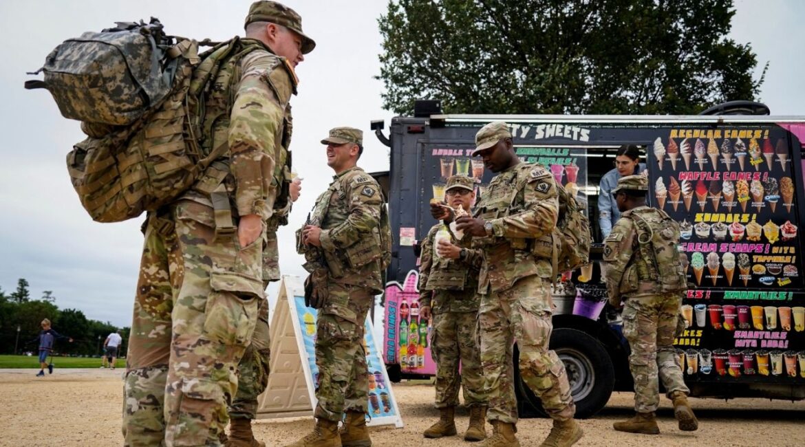Members of the Mississippi National Guard eat ice cream and boba tea on the National Mall after U.S. President Donald Trump deployed the National Guard and ordered an increased presence of federal law enforcement to assist in crime prevention, in Washington, D.C., U.S., August 21, 2025. (Reuters/Al Drago)