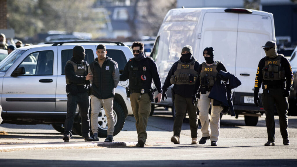 Image of man being detained in Denver by ICE agents