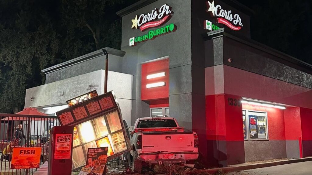 Visalia police arrested Brandon Smith, 30, on Monday night after they say he ran a red light, crashed into a minivan and then slammed his truck into a Carl’s Jr., though no injuries were reported. (Visalia PD)