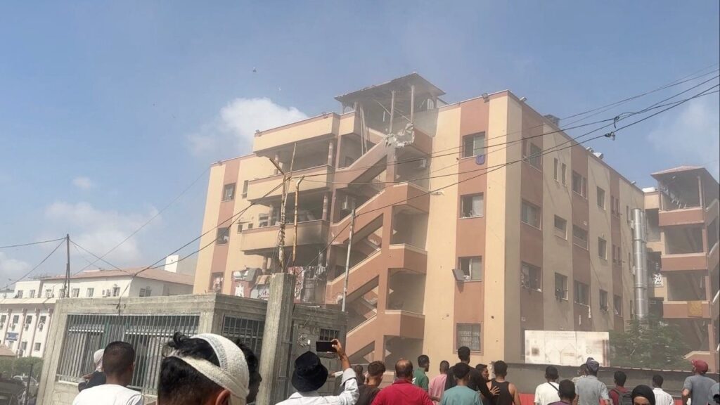 People walk at the site of Israeli strikes on Nasser hospital where Palestinian cameraman Hussam al-Masri, who was a contractor for Reuters, was killed along with other journalists and people, in Khan Younis in the southern Gaza Strip in this still image taken from video, August 25, 2025. (Reuters File)