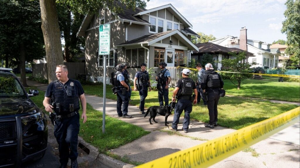 Law enforcement use K-9 dogs to search a nearby neighborhood, after a shooting at Annunciation Church, which is also home to an elementary school, in Minneapolis, Minnesota, U.S. August 27, 2025. REUTERS/Tim Evans