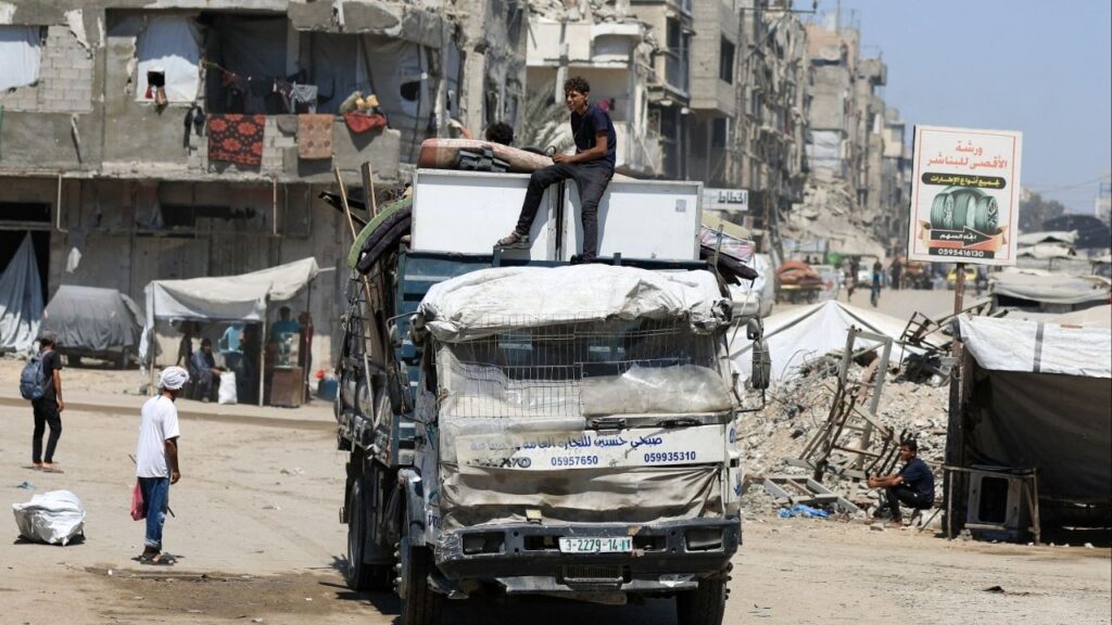 Displaced Palestinians ride on a vehicle loaded with belongings as they flee from one area to another within Gaza City, amid an Israeli military operation, in Gaza City, August 29, 2025. (Reuters File)
