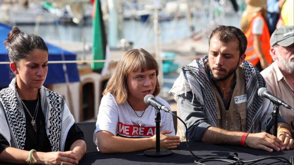 Activists Yasemin Acar, Greta Thunberg and Thiago Avila attend a press conference before the departure of the Global Sumud Flotilla, a humanitarian expedition to Gaza, at the port of Barcelona, Spain August 31, 2025. (Reuters/Eva Manez)